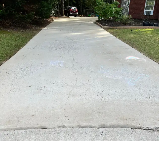 The same driveway washed back to an even pale grey