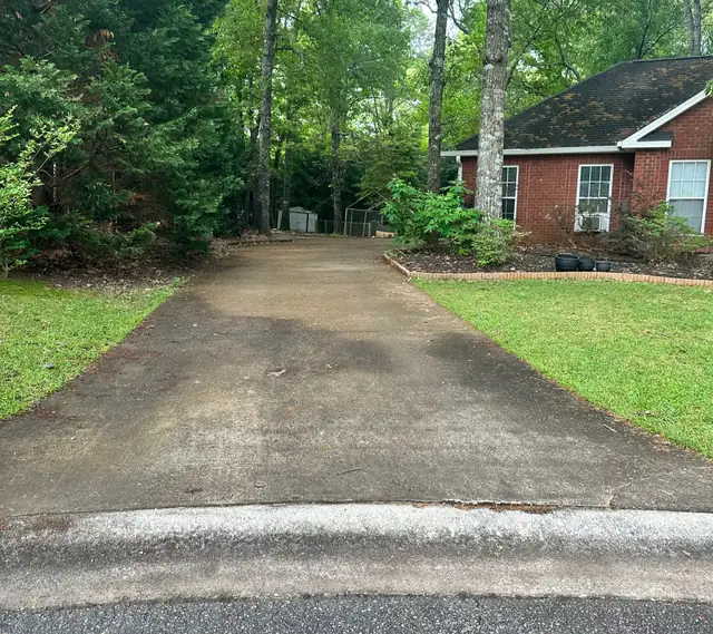 Concrete driveway darkened with years of staining
